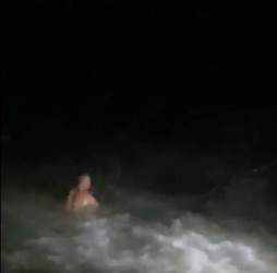 VIDEO Foolish man who went for night time swim in treacherous sea is saved by hero firefighters who dived in after him